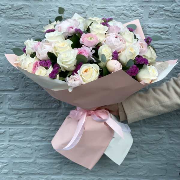 Incredible bouquet with peonies, ranunculus and white roses. The photo shows a deluxe size.