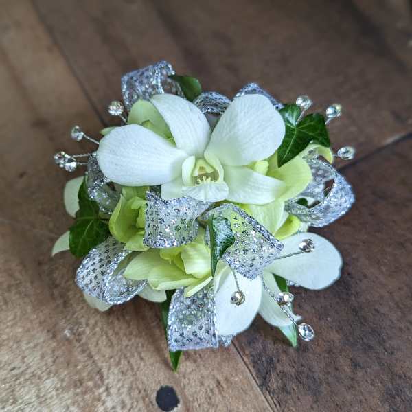 White orchid corsage with silver ribbon and crystal accents