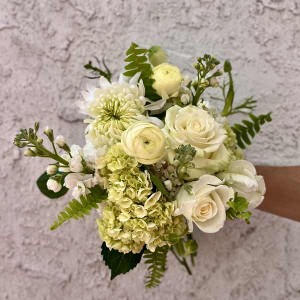 White and pale yellow bouquet with roses, hydrangea, and chrysanthemum