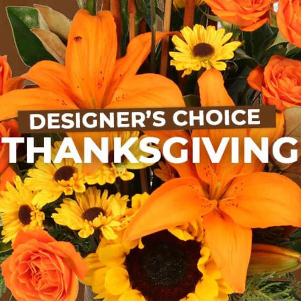 Orange lilies and yellow daisies with roses and a Thanksgiving sign