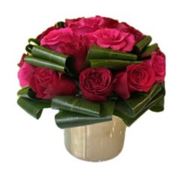 Pink rose bouquet in a gold vase