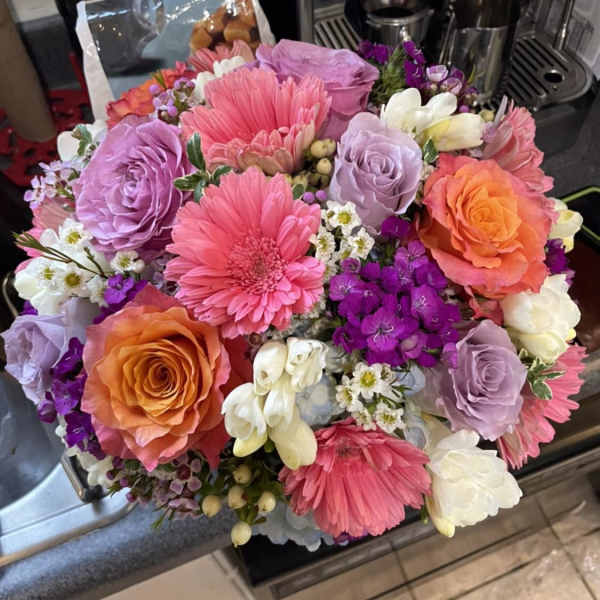 Bouquet of pink, purple, orange, and white flowers