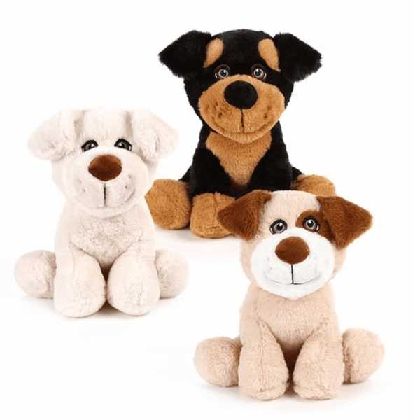Three plush dog toys in white, black, and tan sit on a white background.