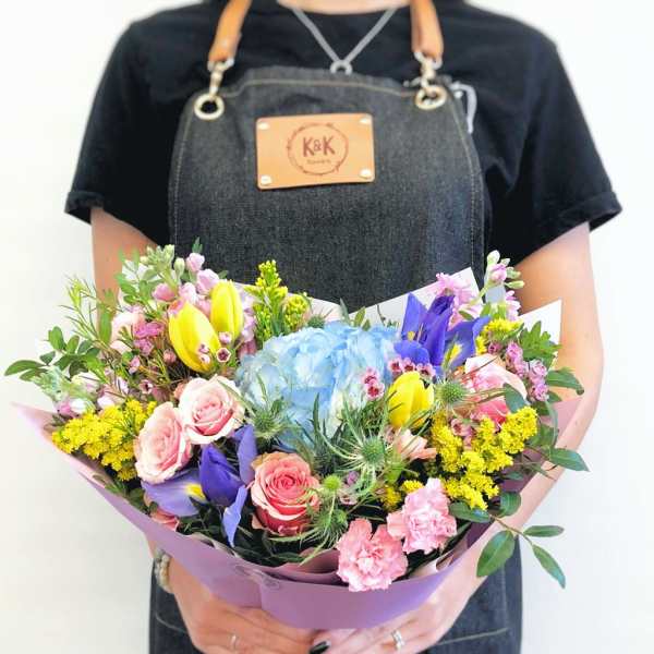 Handheld bouquet with roses, hydrangea, tulips, and purple iris
