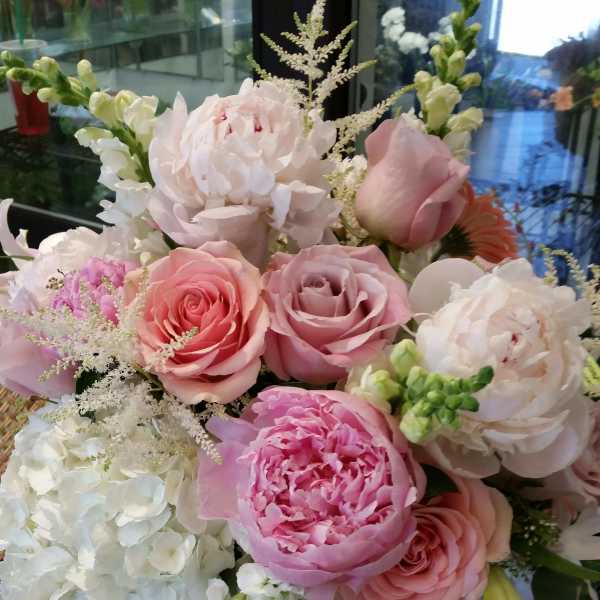 Pink and white mixed bouquet in a clear glass vase