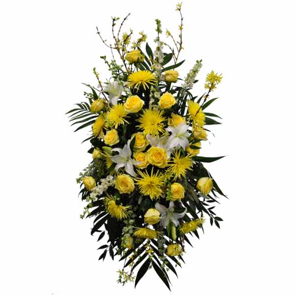 Tall spray of yellow roses and mums with white lilies in an elongated display.