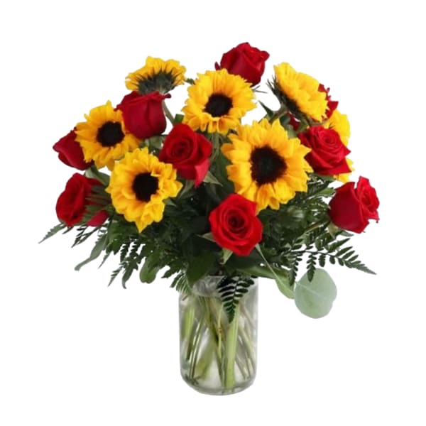 Bouquet of red roses and yellow sunflowers in a glass vase
