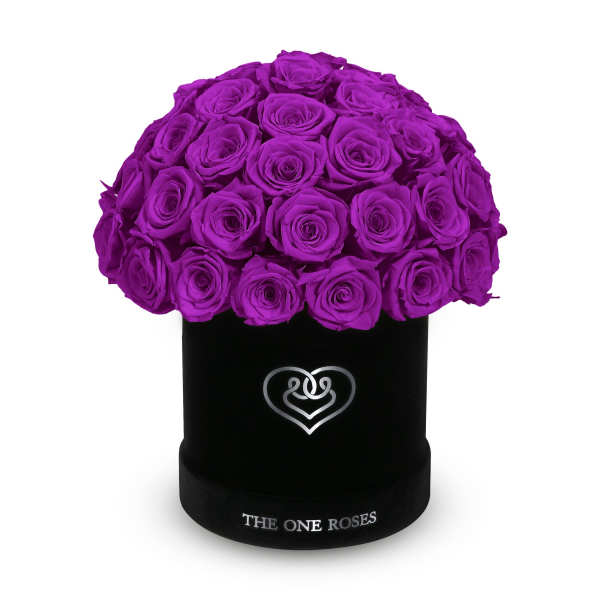 Bouquet of purple roses in a black hat box