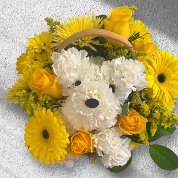 Yellow and white flower basket arranged as a teddy bear face