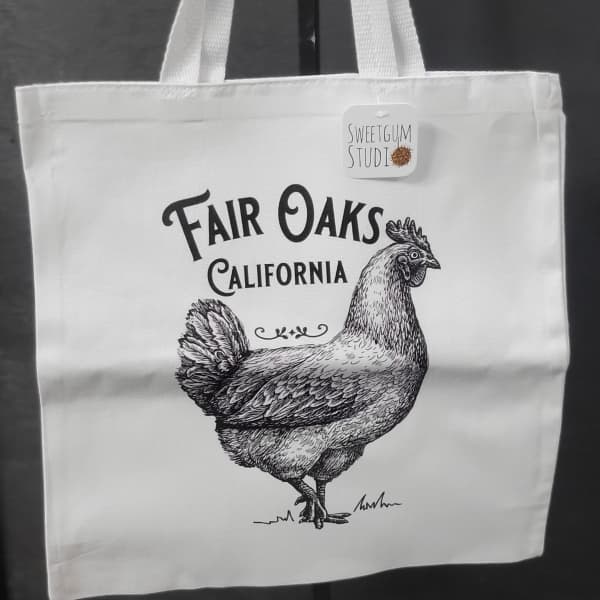 White tote bag with a chicken illustration and Fair Oaks California text