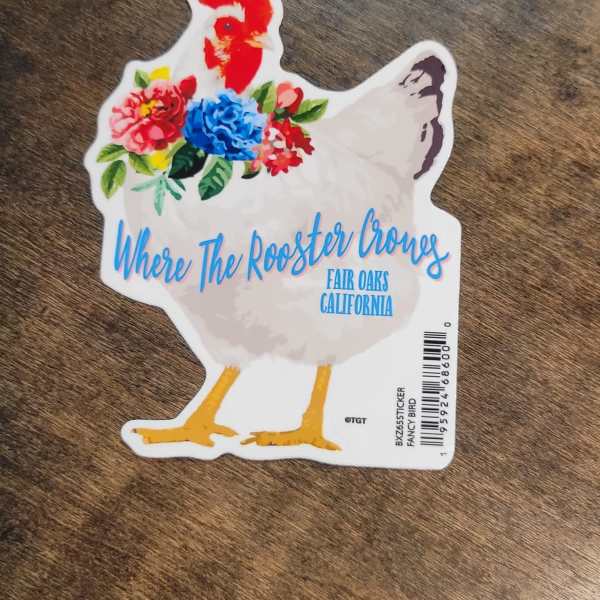 Chicken-shaped sticker with colorful flowers and text