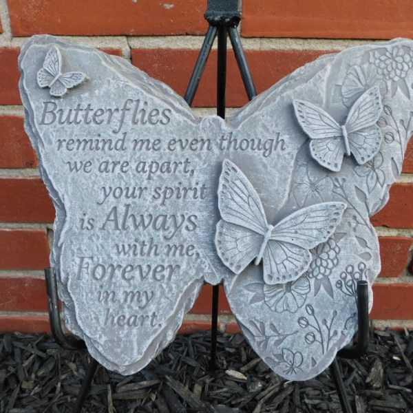 Butterfly-shaped memorial plaque with a sympathy message