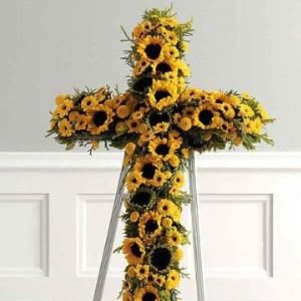 Sunflower cross arrangement on a standing easel