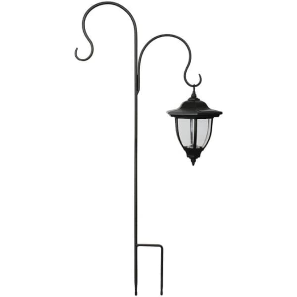Black metal shepherd's hook with a hanging lantern