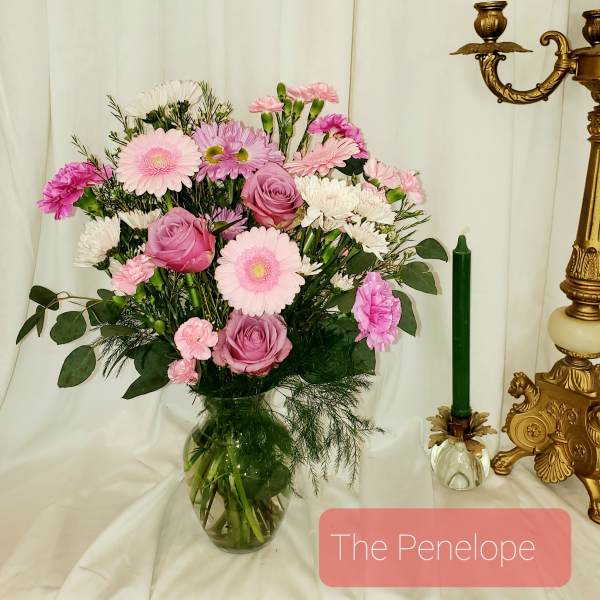 Pink and white mixed bouquet in a glass vase
