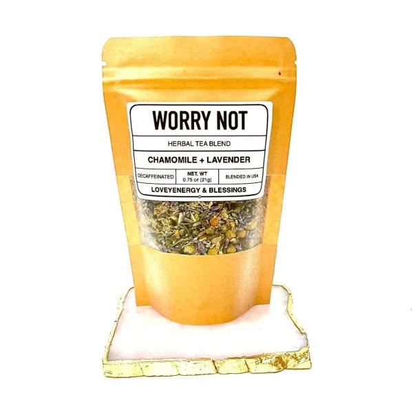 Orange pouch of chamomile and lavender herbal tea blend on a small tray