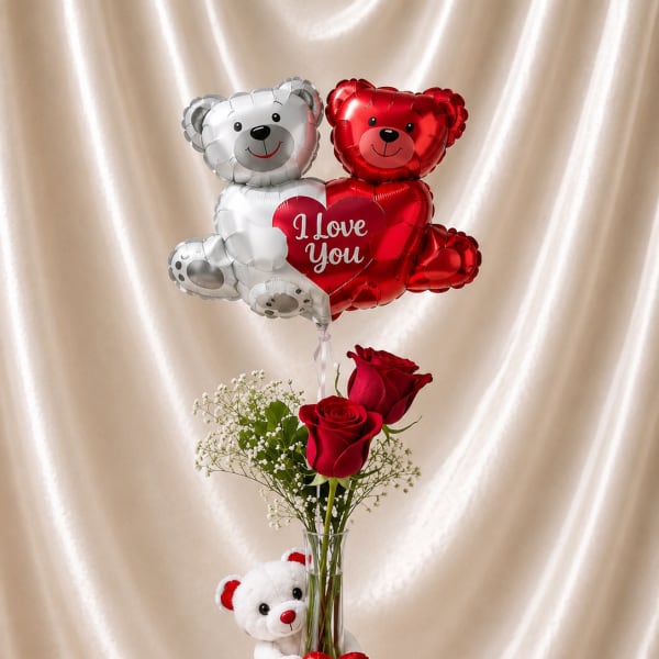 Red roses in a glass vase with teddy bear balloons and a small plush bear