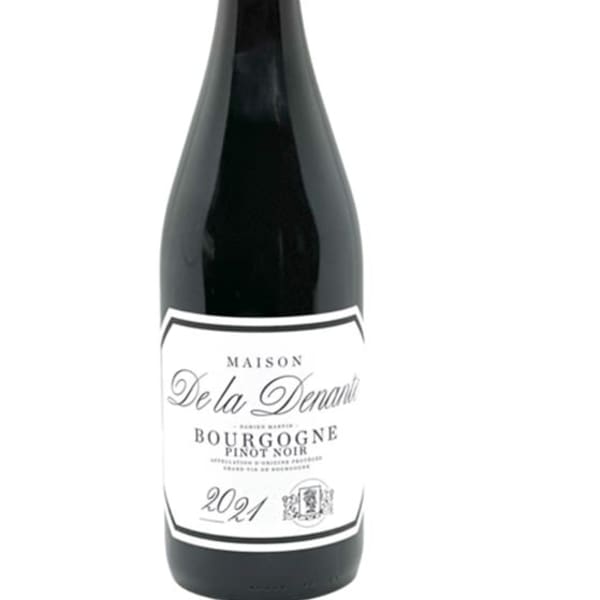 Bottle of red wine with a white label