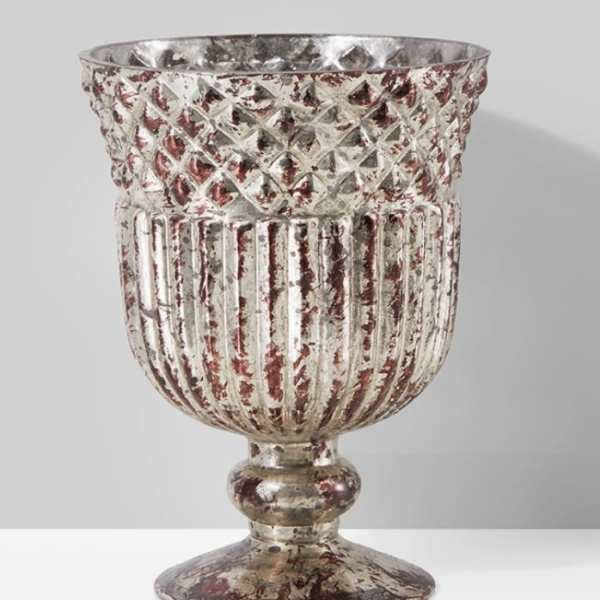 Decorative silver-toned metal urn with a textured, distressed finish