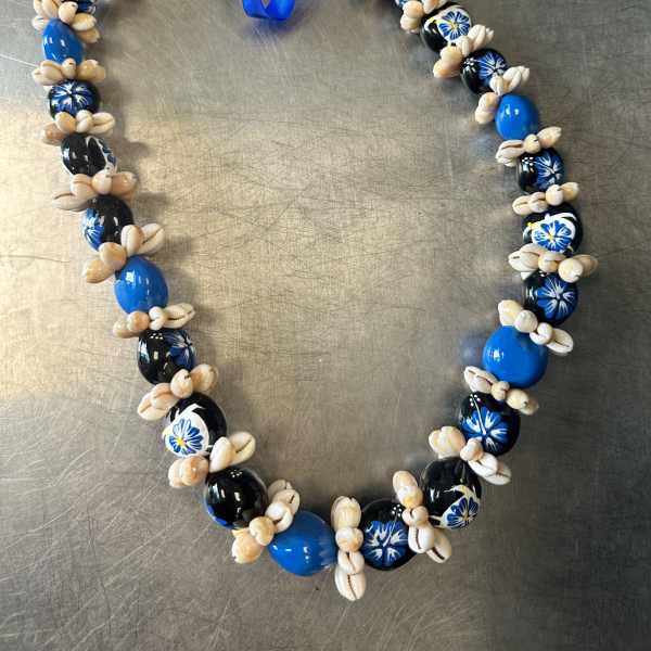 Blue and black beaded lei with a ribbon tie