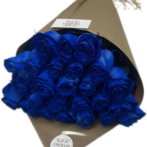Bouquet of vivid blue roses wrapped in brown paper