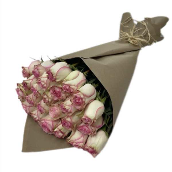Bouquet of pink-edged white roses wrapped in brown paper