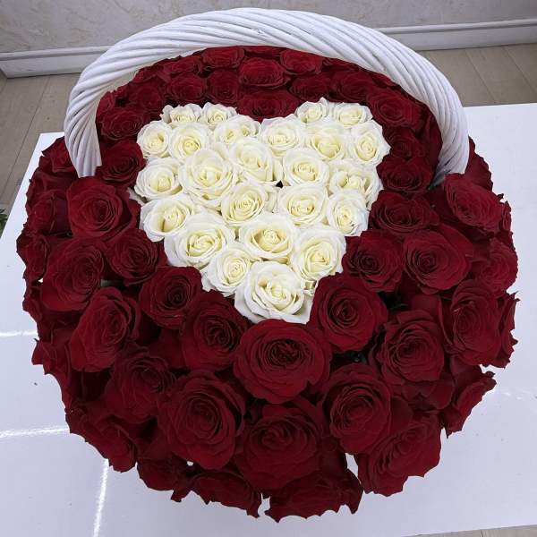 Heart-shaped basket filled with red and white roses