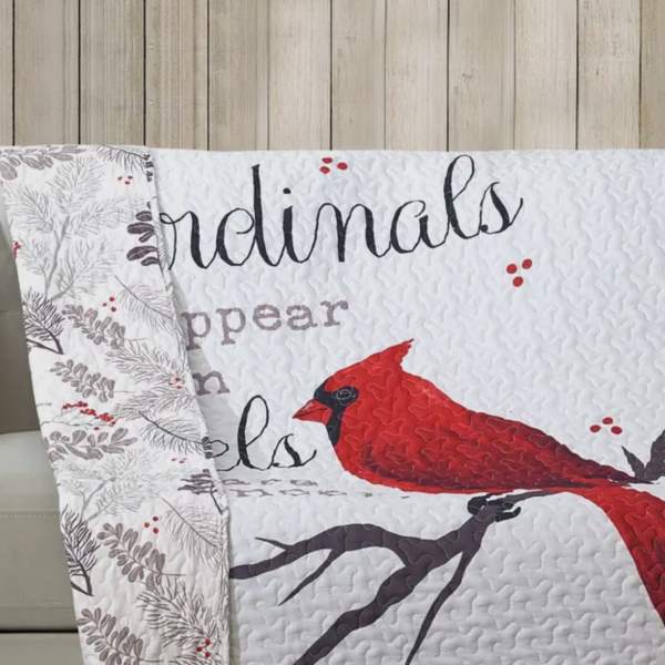 Quilted blanket with a red cardinal and winter lettering