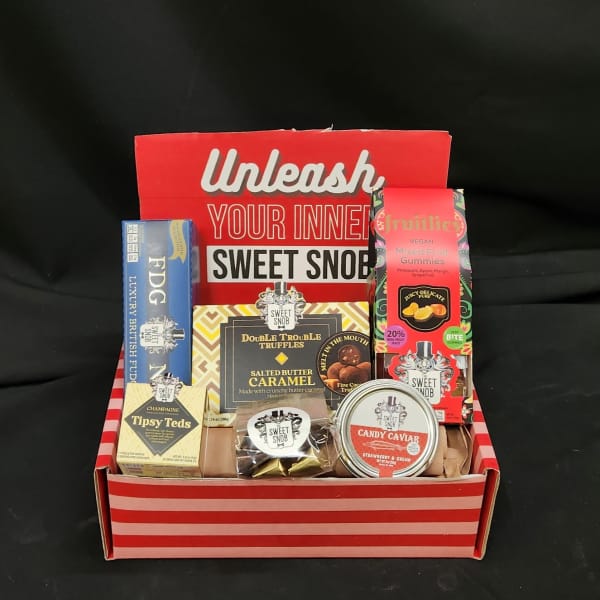 Gift box filled with assorted candy and chocolate packages