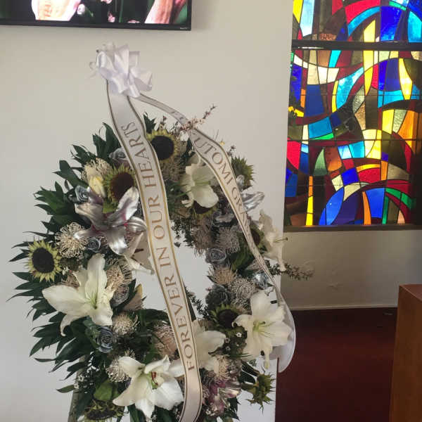 $685 Heavenly Easel Wreath (Oahu Only) Three easel displays and one casket saddle