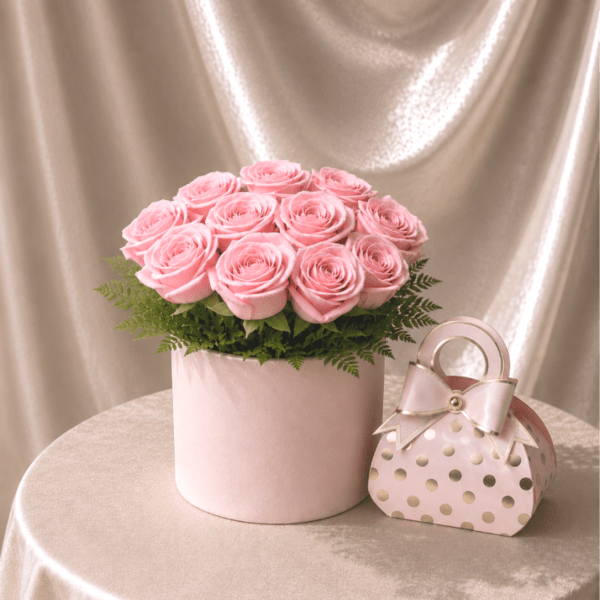 Pink roses in a round box with a matching gift box
