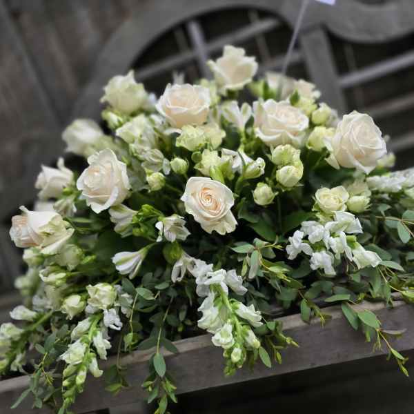 Dearest memories white casket spray