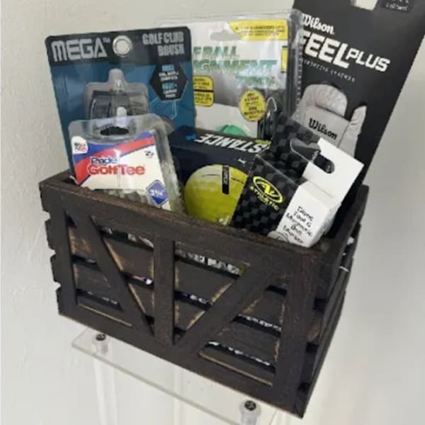 Basket of golf accessories and balls on a wall shelf