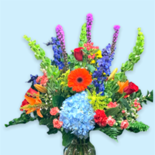 Colorful mixed bouquet in a clear glass vase