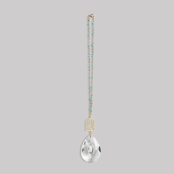 Beaded hanging ornament with gold accent and clear teardrop crystal pendant