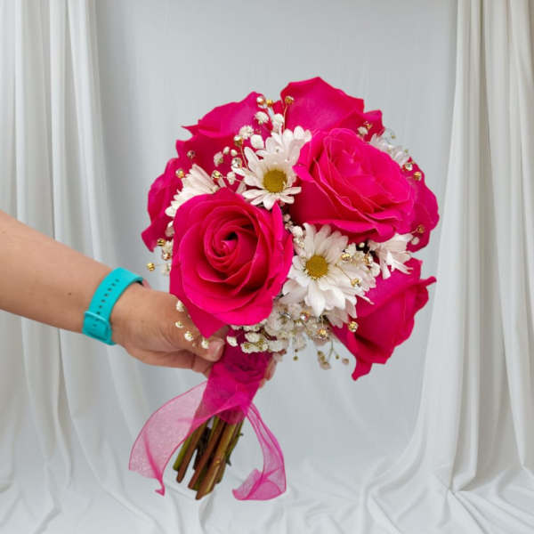 Handheld bouquet of hot pink roses and white daisies with a pink ribbon