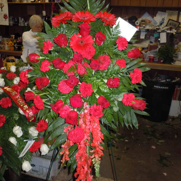 Large red funeral spray with roses and gerbera daisies