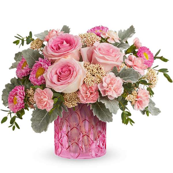 Pink roses and carnations in a pink glass vase