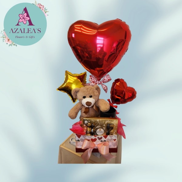 Gift set with heart balloons, teddy bear, and chocolates