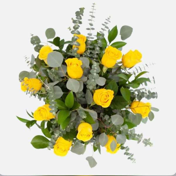 Yellow roses with eucalyptus greenery on a white background