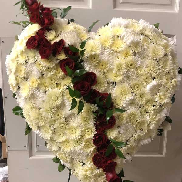 Heart-shaped floral spray with white chrysanthemums and red roses