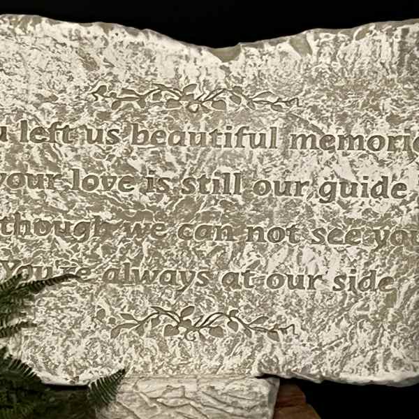 Engraved memorial stone with a sympathy message