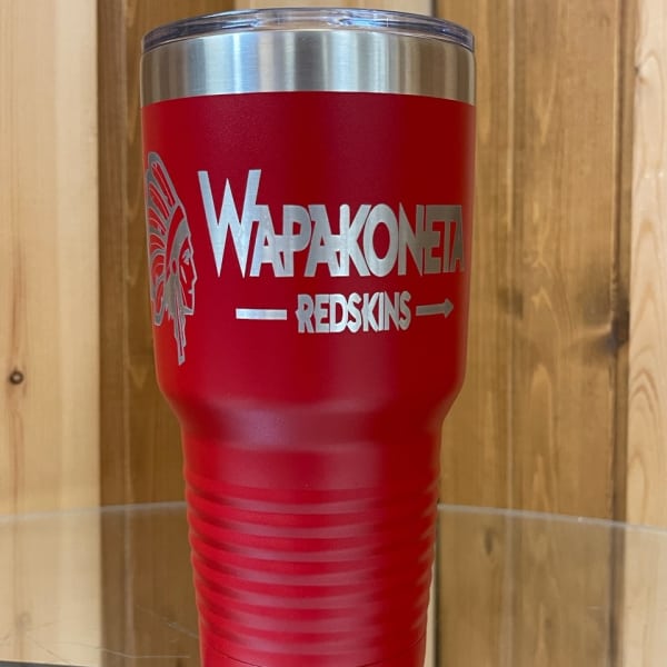Red insulated tumbler with a sports team logo and text