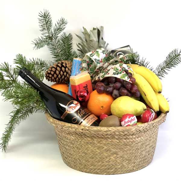 Gift basket with fruit, cheese, chocolate, and a wine bottle