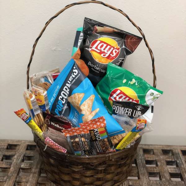 Basket filled with assorted snack bags and candy bars
