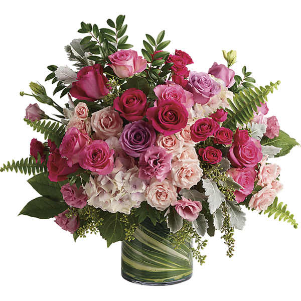 Pink and lavender rose bouquet in a green glass vase