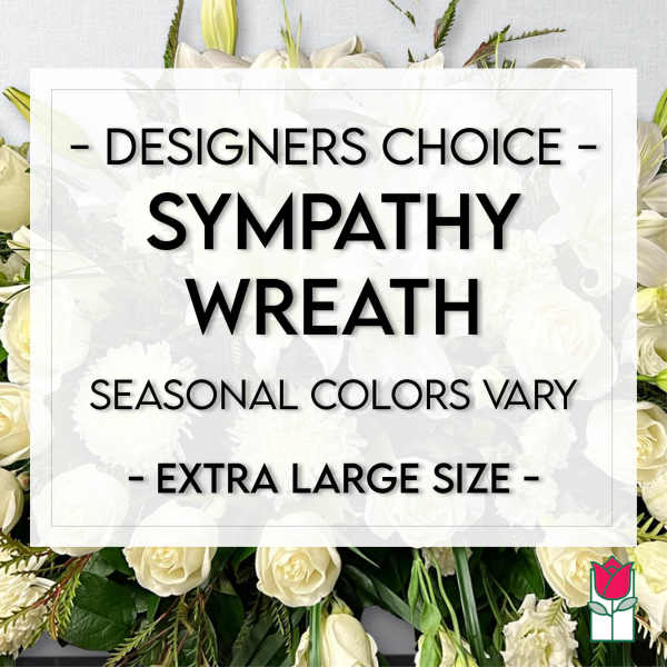 White sympathy wreath with roses and lilies