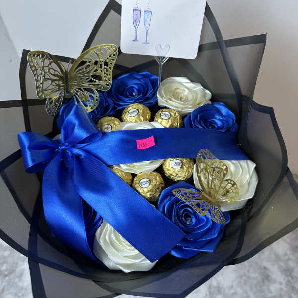 Blue and white satin rose bouquet with chocolates and a champagne card