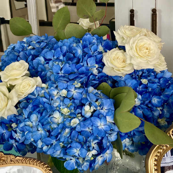 Blue hydrangea bouquet with white roses and eucalyptus