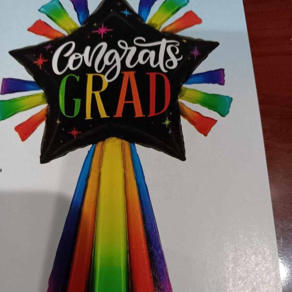 Rainbow graduation balloon with "Congrats Grad" text